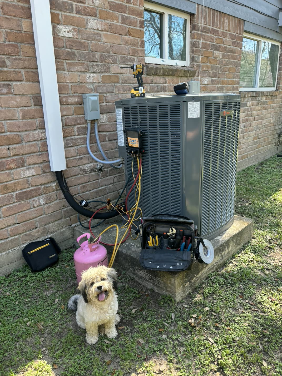 HVAC Technician working on Residential AC